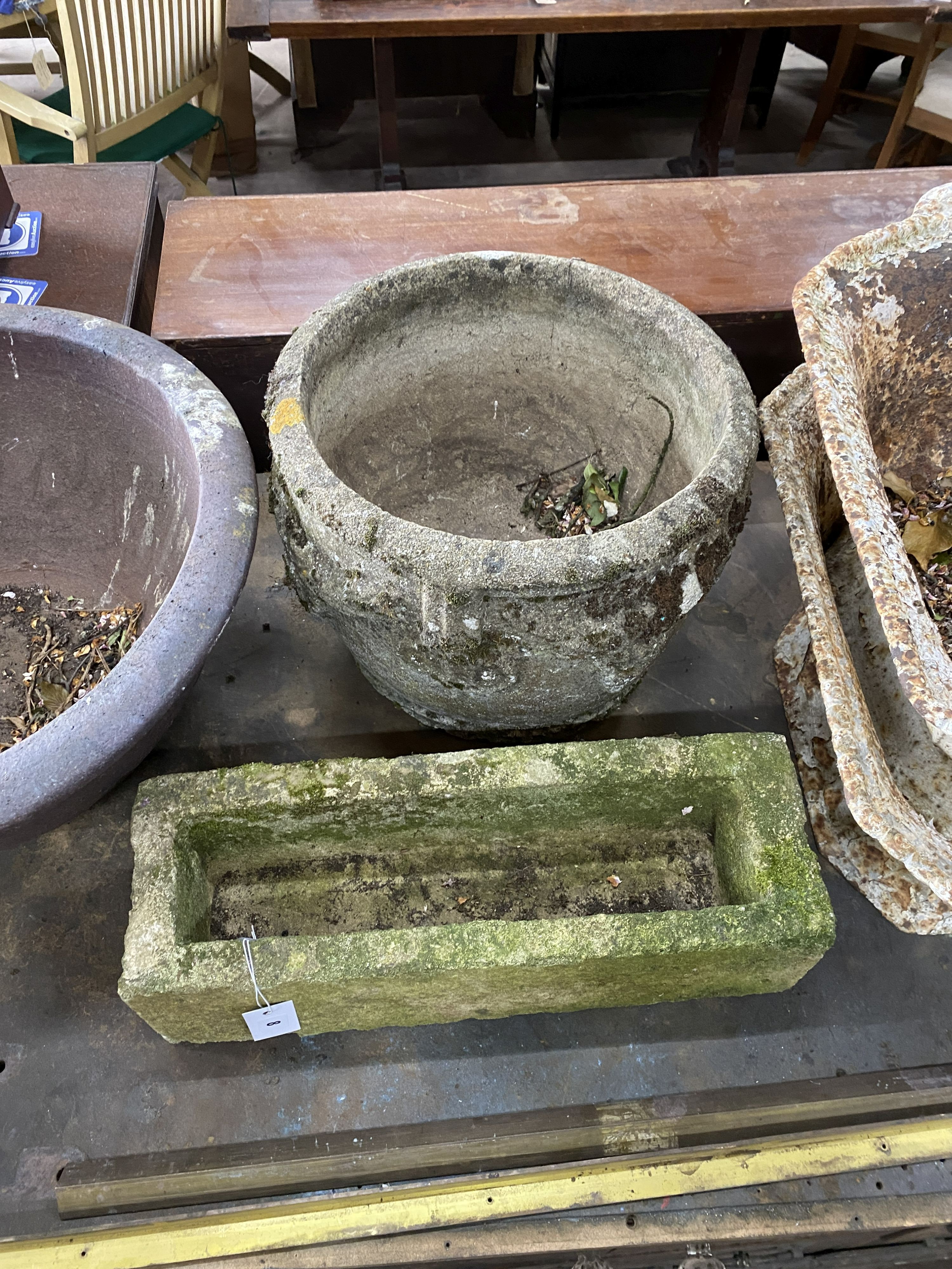 A circular reconstituted stone garden planter, diameter 38cm, height 32cm together with a smaller rectangular planter